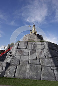 construction of rock pyramid over the water fountain with sculpture of the inca pachacutec cuzco peru june 2015