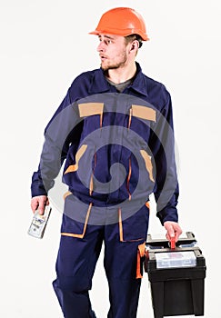 Construction and rollback concept. Man with toolbox walks, holds money.