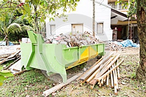 Construction rubbish bin with loads at construction site.