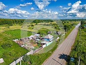 Construction of a rural house on the site of an old house and organization of personal farming in central Russia