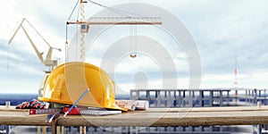 Construction safety equipment with cranes in front of the unfinished building