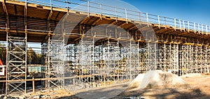 Construction scaffolding built under an overpass over the highw