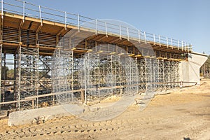 Construction scaffolding built under an overpass over the highw