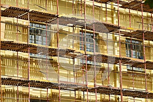 Construction scaffolding on the facade of the house.