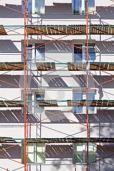 Construction scaffolding near wall of residential building