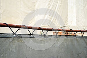 Construction scaffolding and white debris netting in the city