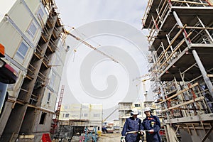 Construction scaffoldings and workers