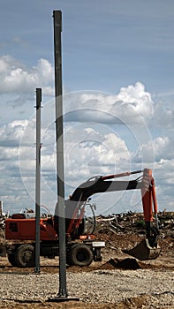 Construction of the shop of metal .Workers and equipment on the construction site.