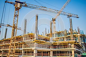 construction of a shopping center with large equipment cranes