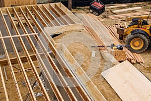 Construction showing massive solid wood joists construction forklift loader