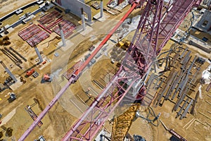 Construction site from above. Aerial view of workplaces in construction equipment, workers with heavy machinery. Industrial top