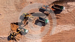 Construction site, Aerial top view road roller and loader excavator tractor and soil grade car earthmoving at work, Heavy