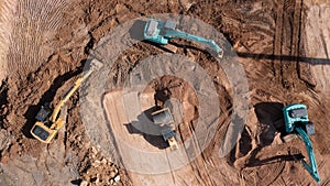 Construction site, Aerial top view road roller and loader excavator tractor and soil grade car earthmoving at work, Heavy