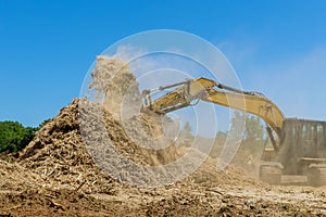 Construction site area in wood chipper machine with mulch an work