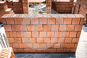 Construction site with brickwork and bricklaying. Industrial details photo