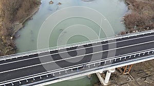 Construction site of a bridge across the road . Bird eye. big faucet. Aerial view of the construction of the bridge