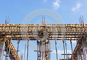 Construction site of concrete building with wooden frames