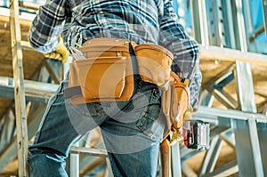 Construction Site Contractor on a Ladder