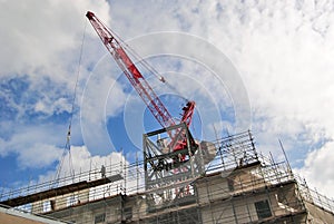 Construction site with crane against blue  sky,UK.