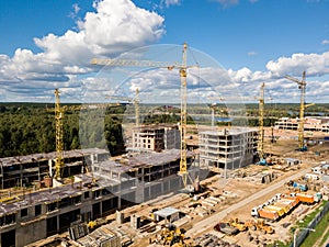 Construction site with crane and building. Aerial drone view