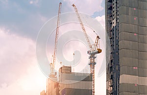 Construction site with crane and building. Real estate industry. Crane use reel lift up equipment in construction site. Apartment