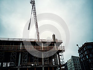 Construction site crane is lifting a precast