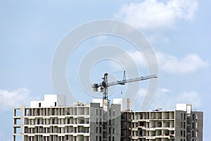 Construction site with cranes against blue sky, Building Construction.