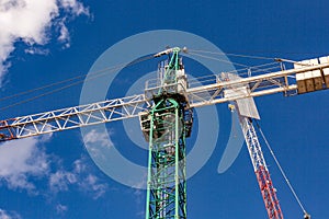 Construction site with cranes with blue sky
