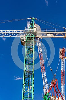 Construction site with cranes with blue sky