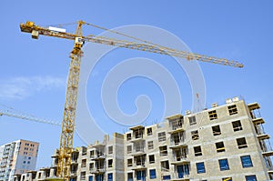 Construction site, cranes building an apartment building