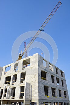 Construction site, cranes, building a house