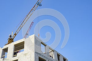 Construction site, cranes, building a house