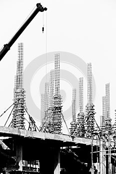 Construction site with cranes on silhouette background