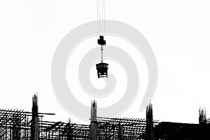 Construction site with cranes on silhouette background