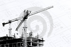 Construction site with cranes on silhouette with drawing background