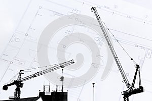 Construction site with cranes on silhouette with drawing background