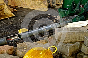 Construction site in downtown at night with excavator shovel, excavator and construction equipment