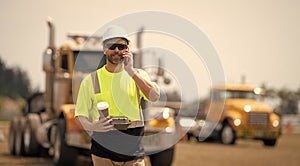 construction site engineer man talk on phone at coffee lunch break, copy space banner