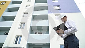 Construction site engineer with tablet checking building technology process.