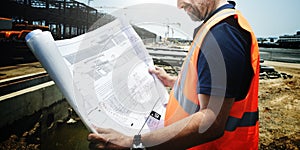 Construction Site Engineer Working Blueprint Concept