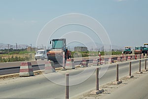 Construction site equipment Heavy vibration roller compactor or road roller for building new road, compacting asphalt