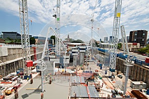 Construction site with a few cranes at early stage photo