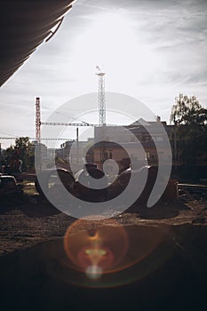 construction site geound and objects suburbs and pipes in sunset