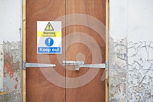 Construction site health and safety message rules sign board signage on door boundary