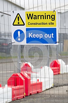 Construction site health and safety message rules sign board signage on fence boundary