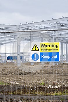 Construction site health and safety message rules sign board signage on fence boundary