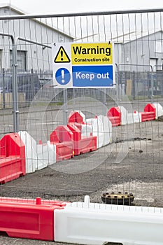 Construction site health and safety message rules sign board signage on fence boundary