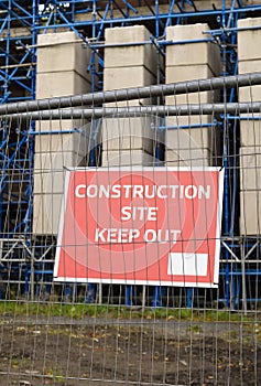 Construction site health and safety message rules sign board signage on fence boundary