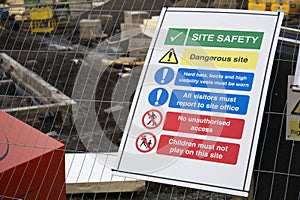 Construction site health and safety message rules sign board signage on fence boundary