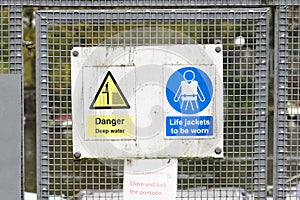 Construction site health and safety message rules sign board signage on fence boundary